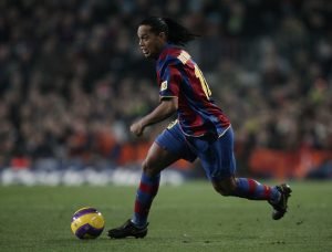 BARCELONA, SPAIN - DECEMBER 23:  Ronaldinho of Barcelona controls the ball during the La Liga match between Barcelona and Real Madrid at the Camp Nou Stadium on December 23, 2007 in Barcelona, Spain. Barcelona lost 'El Clasico' with 1-0.  (Photo by Jasper Juinen/Getty Images)